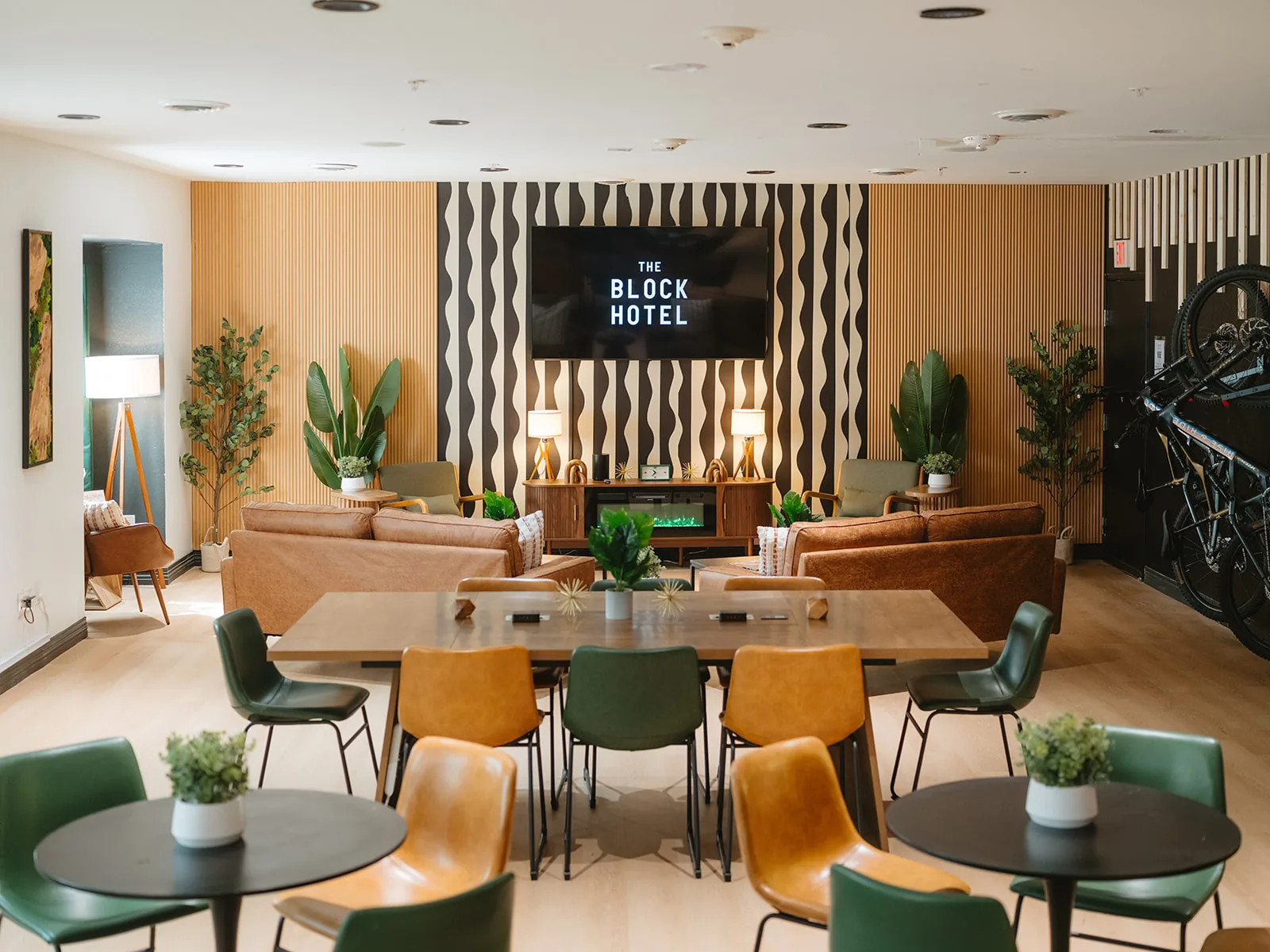 THE BLOCK HOTEL's Vibe Lounge with communal seating and wall-mounted bikes